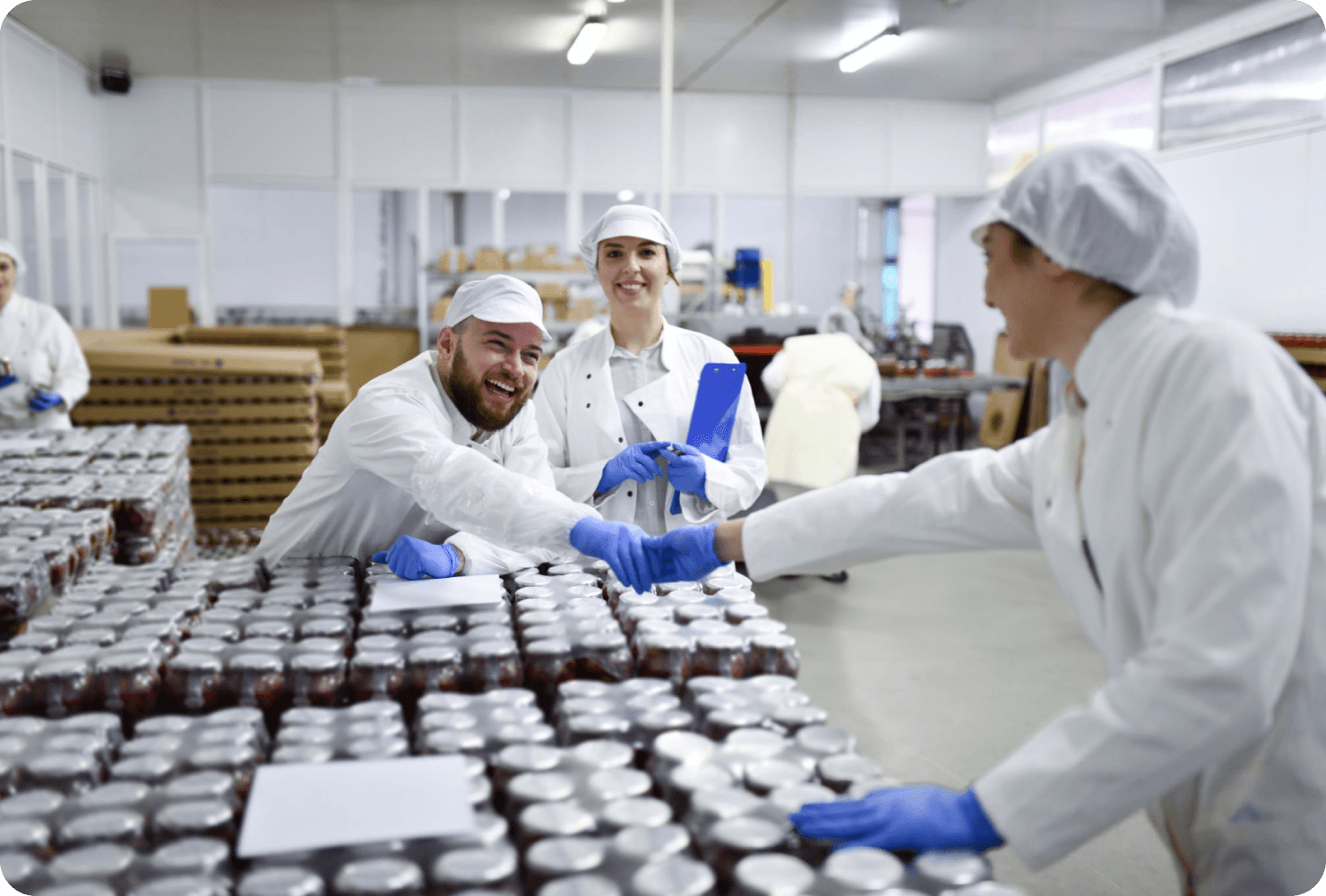 Group of people in a factory setting